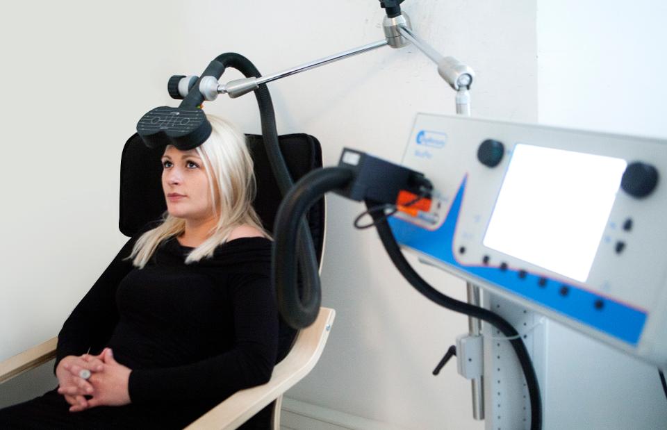 woman undergoing TMS as part of her anxiety treatment with MeRT.