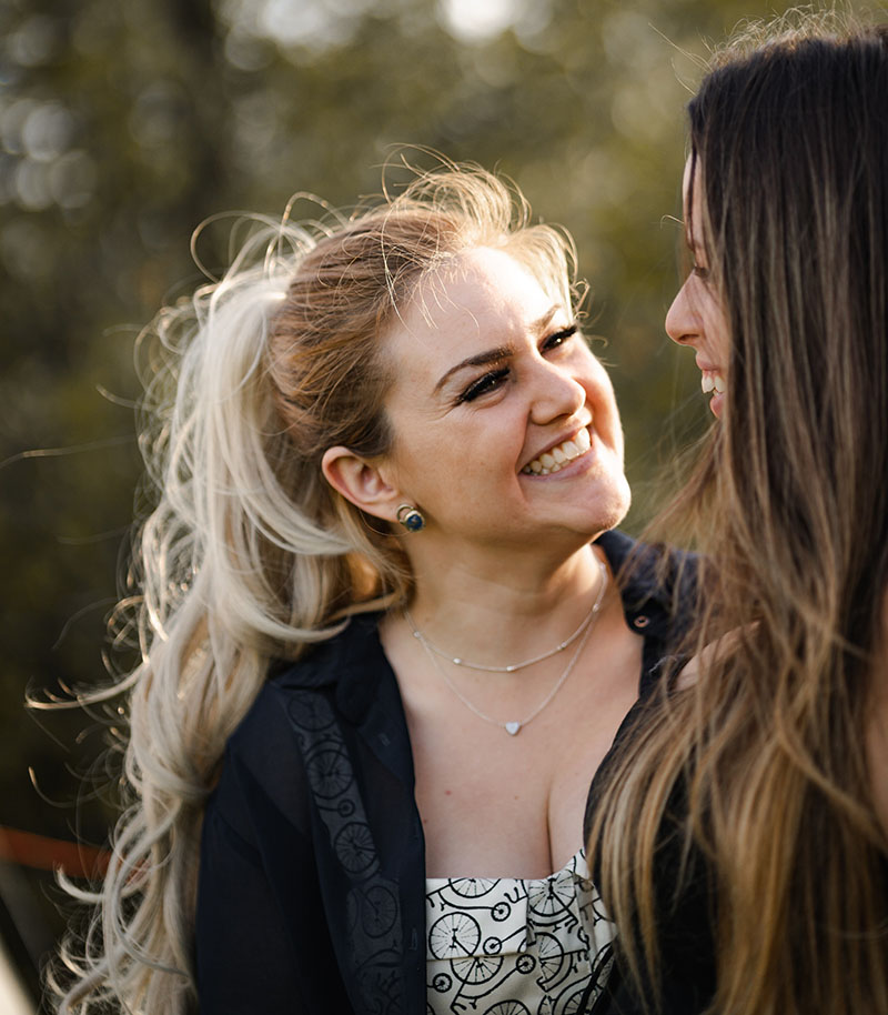 Women smiling at each other